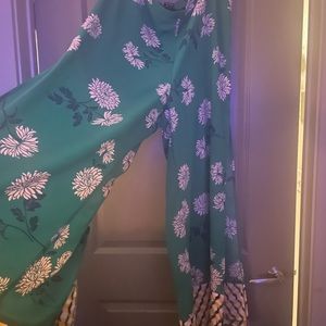 Pants with slits on both pant legs. Green, yellow,pink, white, and blue colors.